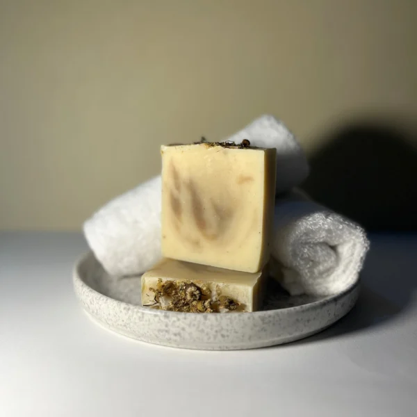 Handmade lemongrass soap with lemon essential oil, moringa powder, chamomile flowers and natural swirl design